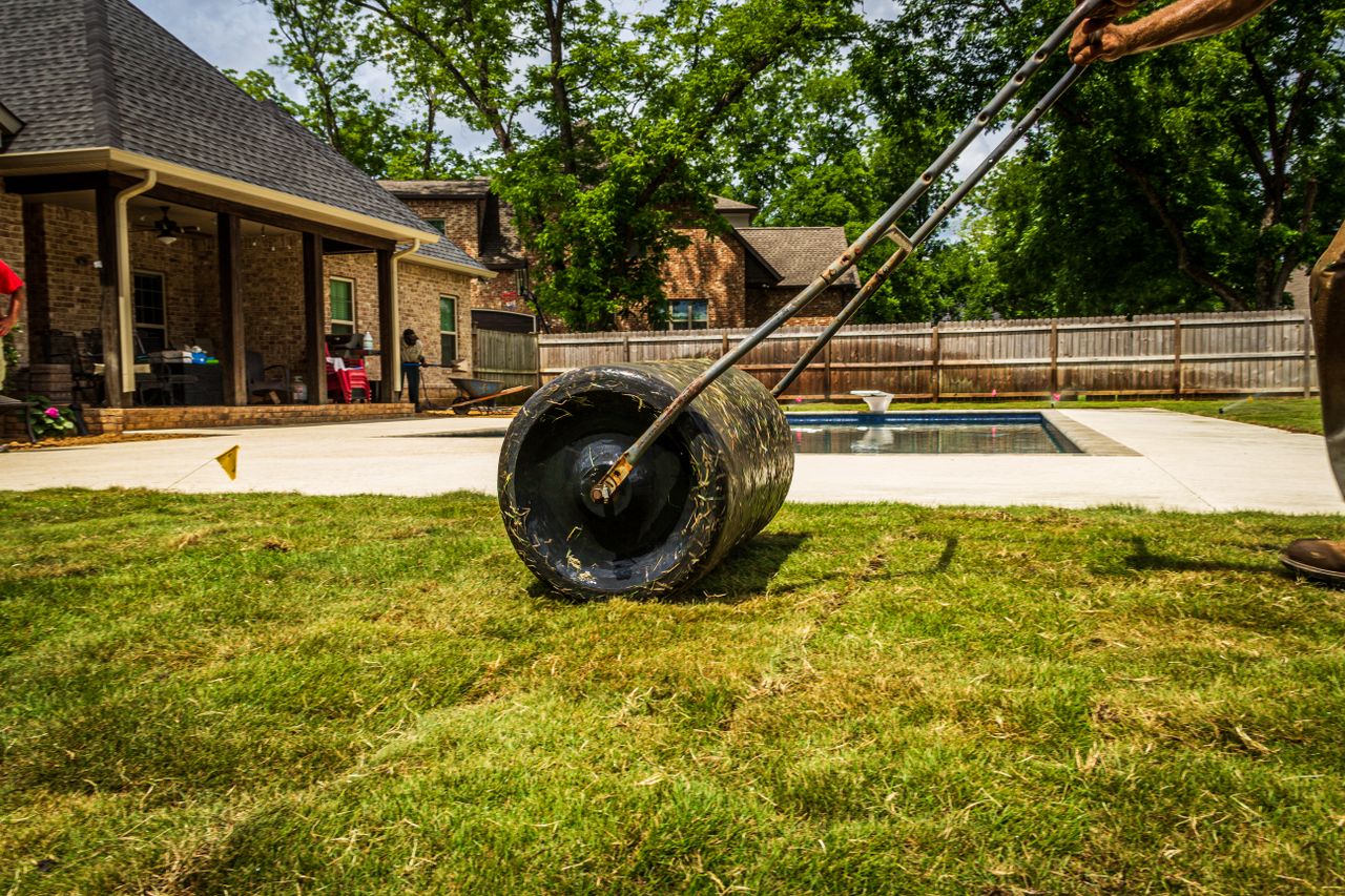 Rolling turf out across a suburban yard